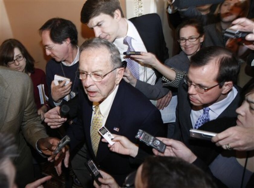 Sen. Ted Stevens, R-Alaska, is pursued by members of the media on Capitol Hill in Washington, Tuesday, Nov. 18, 2008, after attending a Republican Caucus . (AP Photo/Gerald Herbert)