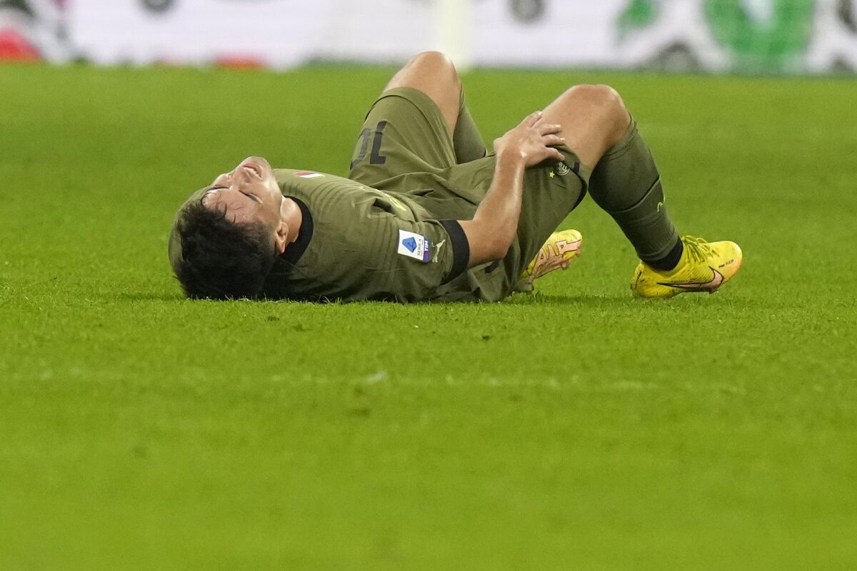 AC Milan's Brahim Diaz lies in pain after gets injured during a Serie A soccer match between AC Milan and Monza, at the San Siro stadium in Milan, Italy, Saturday, Oct. 22, 2022. (AP Photo/Luca Bruno)