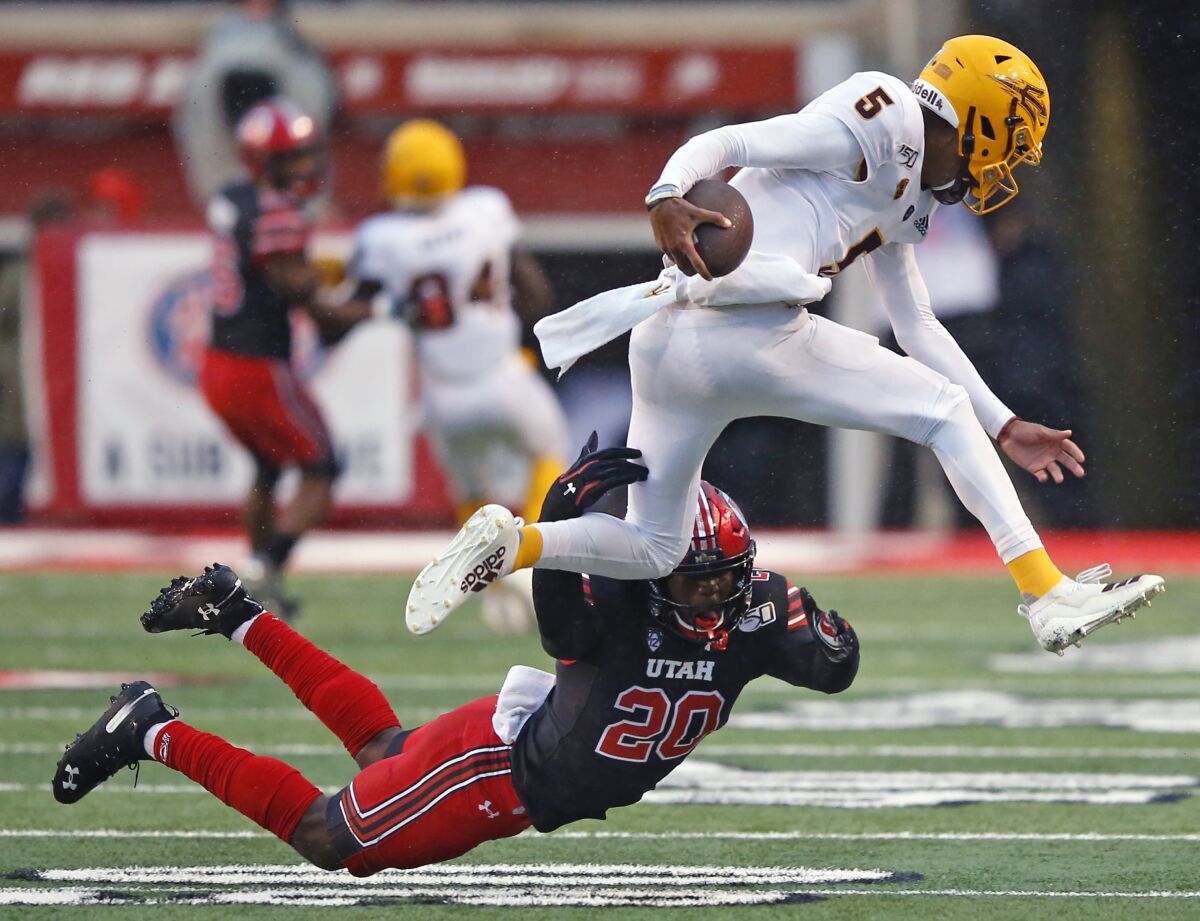 FILE - In this Oct. 19, 2019, file photo, Utah linebacker Devin Lloyd (20) tackles Arizona State quarterback Jayden Daniels (5) during the first half of an NCAA college football game in Salt Lake City. Experience is in short supply on the Utah defense as it prepares to head into the pandemic-shortened season. The Utes return only two full-time starters – junior defensive end Mika Tafua and junior linebacker Lloyd – from a unit that took the Pac-12 by storm a year ago. (AP Photo/Rick Bowmer)