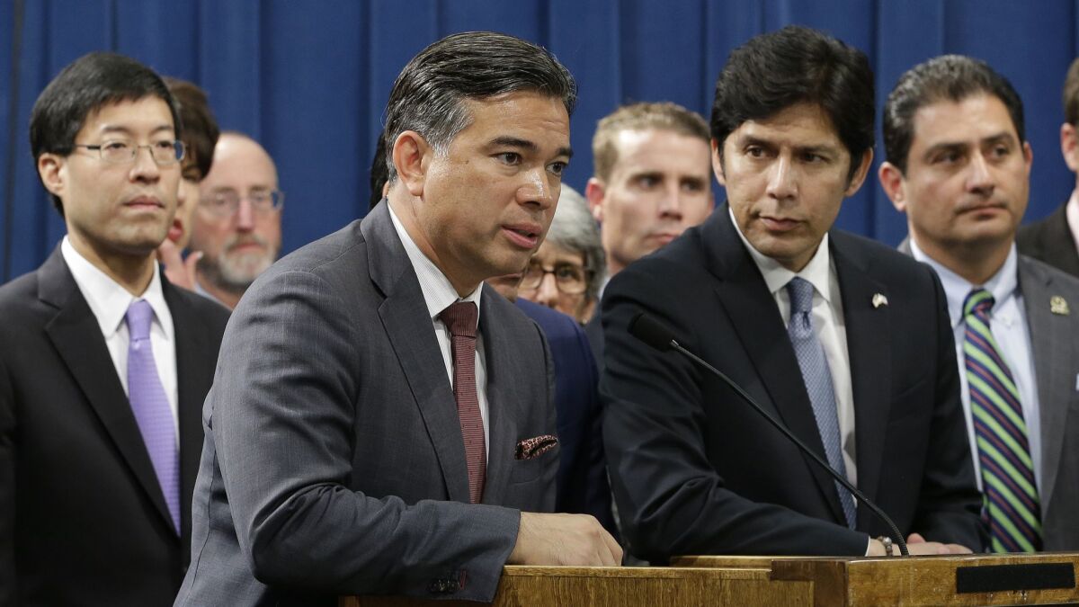 Assemblyman Rob Bonta (D-Oakland), second from left, seeks to bar the state from signing contracts with companies that do business with federal immigration agencies.