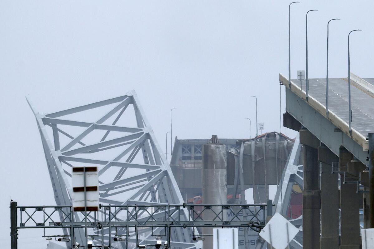 Efforts underway to remove Baltimore bridge ruins; search suspended for 4 workers presumed dead