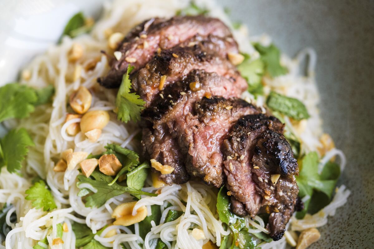 This image released by Milk Street shows a recipe for ginger beef and rice noodle salad. (Milk Street via AP)
