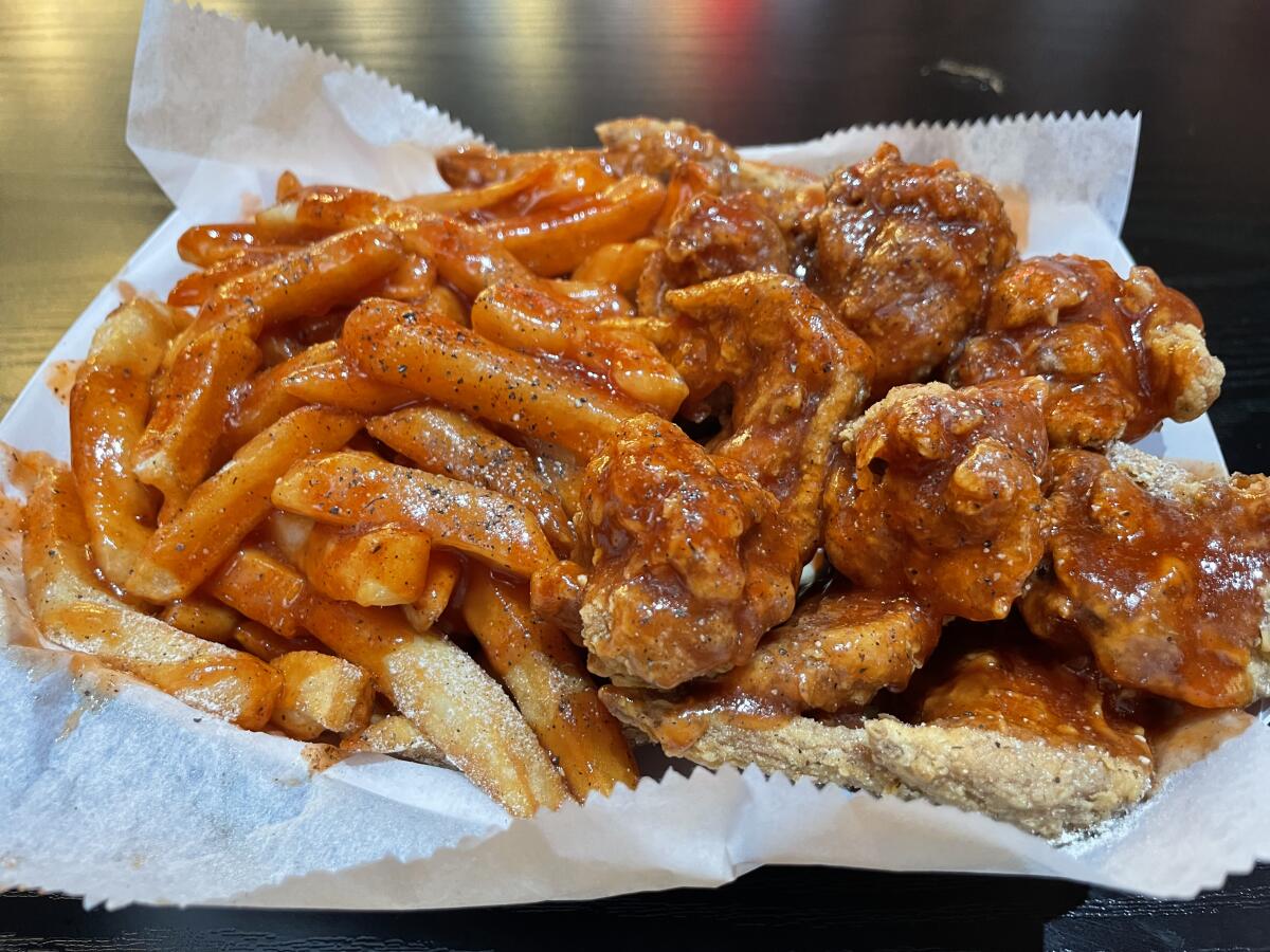 Chicken and fries on a platter.