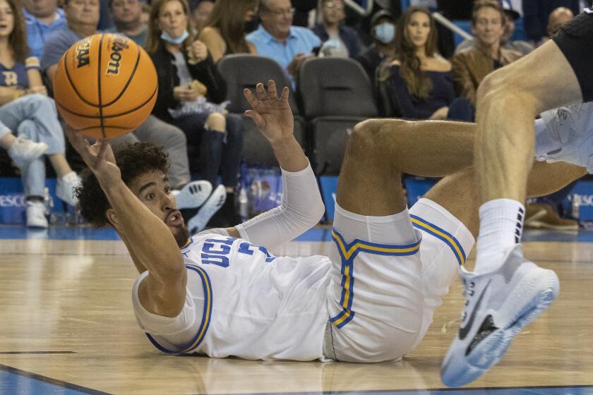 WESTWOOD, CA - November 15 2021: Bruins Johnny Juzang passes from the floor.