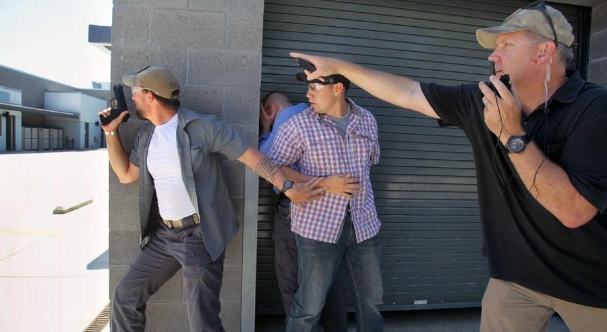 Lead instructor Rick Sweeney, right, leads a protect-and-evacuate exercise at the Carlsbad Safety Training Center.