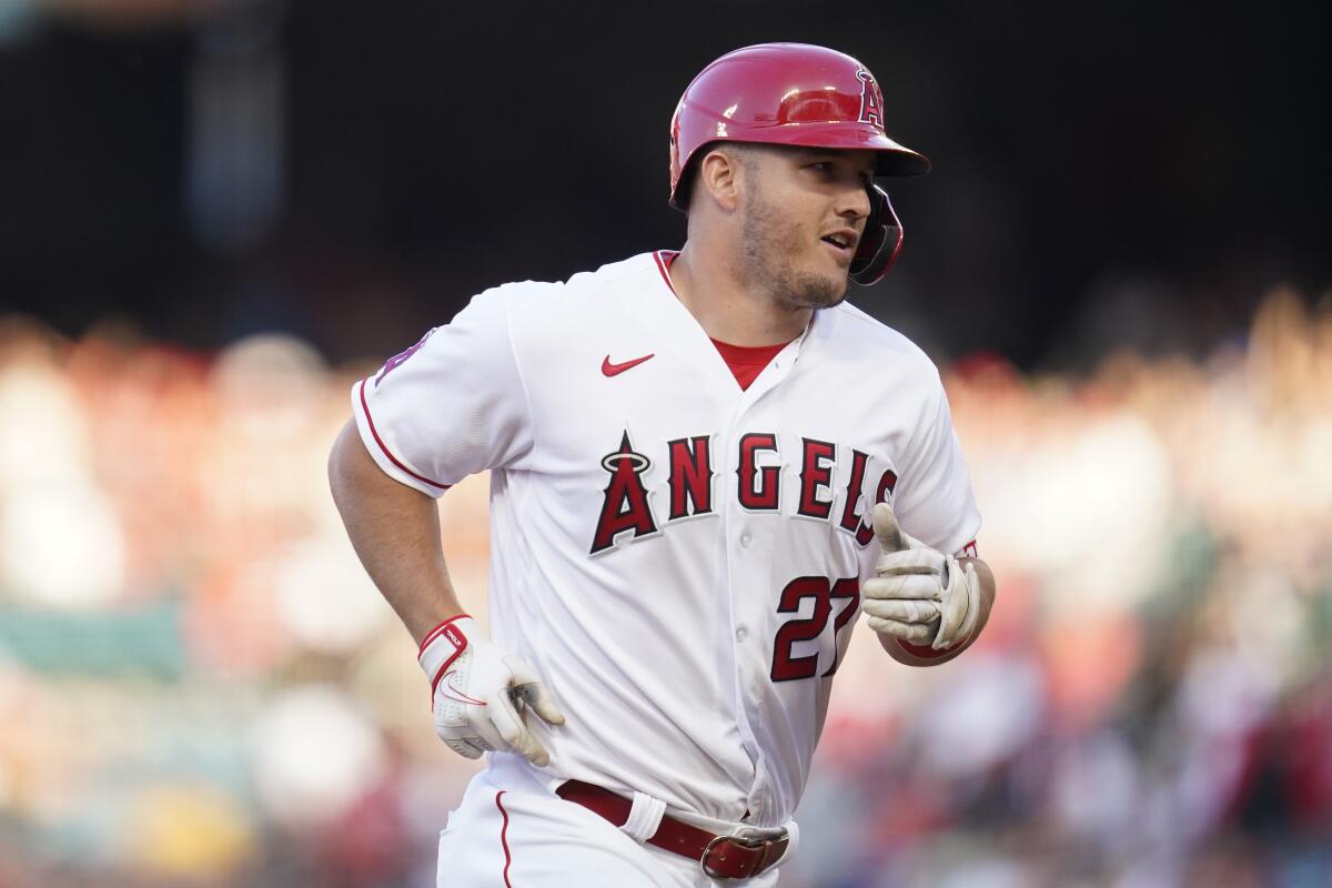 Angels center fielder Mike Trout (27) runs the bases after hitting a home run.