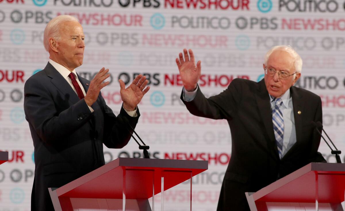 Biden and Sanders on debate stage 