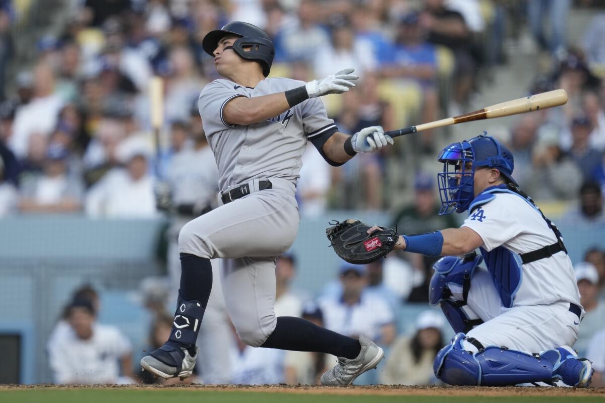 New York Yankees' Anthony Volpe hits a home run during the ninth inning Sunday against the Dodgers.