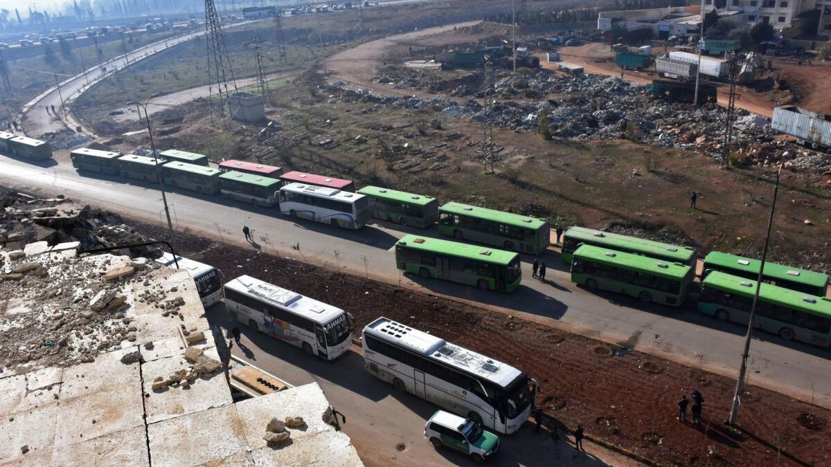 Civilians from the remaining rebel-held pockets of eastern Aleppo are evacuated by bus on Dec. 19, 2016.