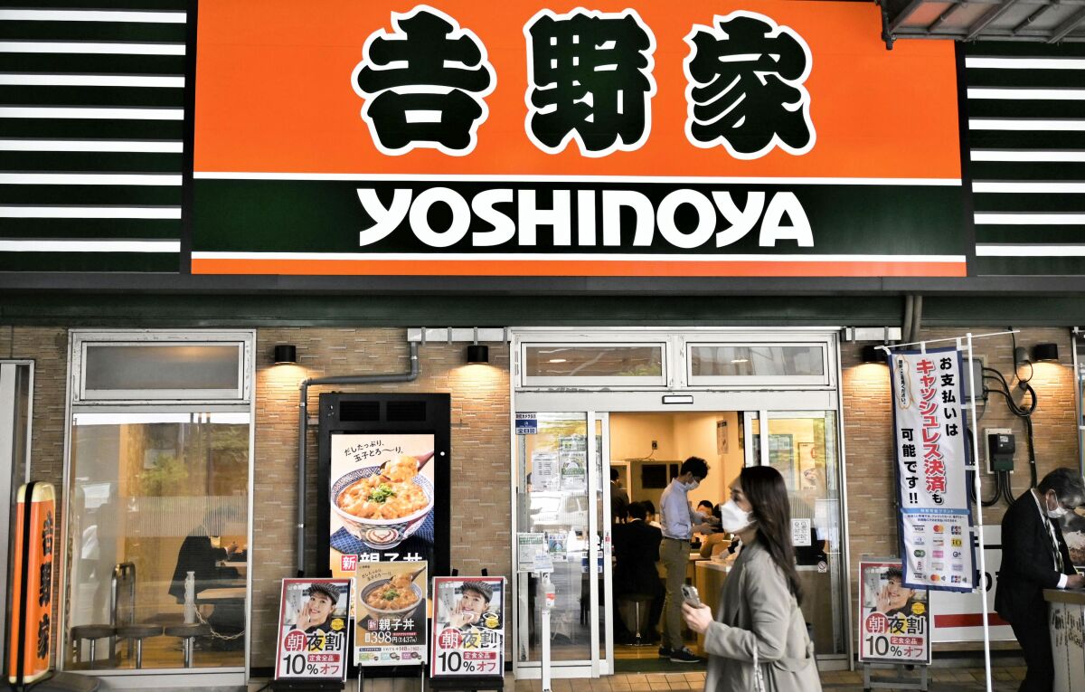 One of Yoshinoya Holding Co. restaurants is seen on April 19, 2022, in Tokyo. A popular Japanese beef bowl chain, Yoshinoya Holdings Co., has fired an executive over sexist remarks he made about a marketing strategy aiming to get young women “hooked” on its products as though turning “virgins into drug addicts.” (Kyodo News via AP)
