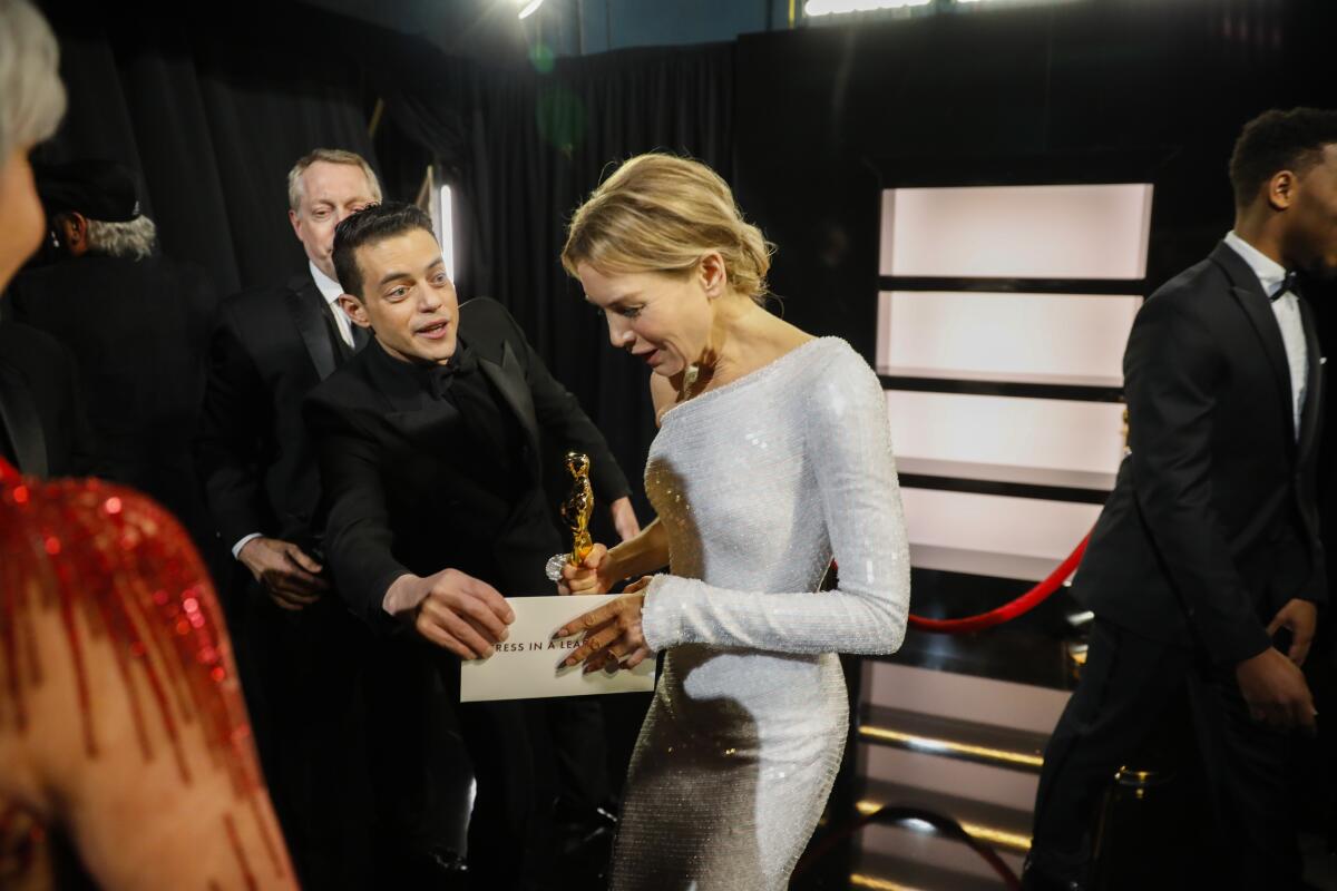 Renée Zellweger, winner of the lead actress Oscar for “Judy” and Rami Malek backstage at the 92nd Academy Awards.