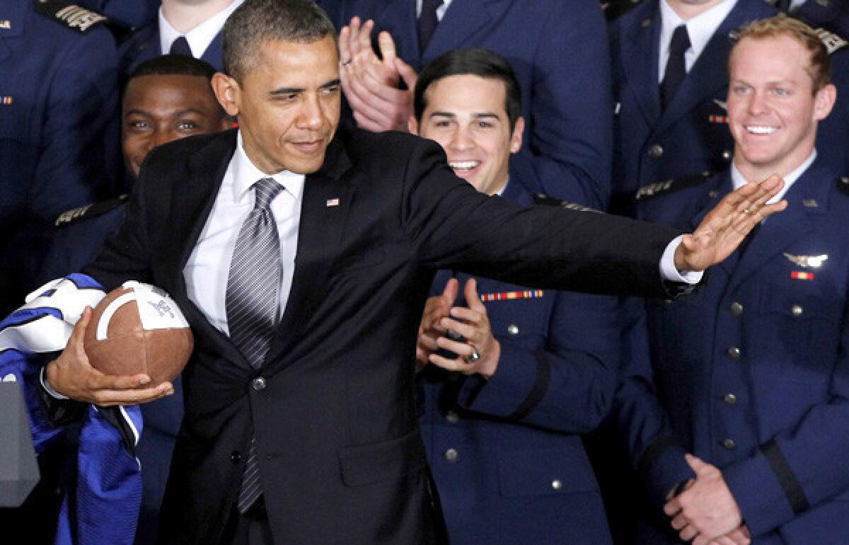 President Obama strikes the Heisman pose after he awarded the Commander-in-Chief Trophy to Air Force last spring.