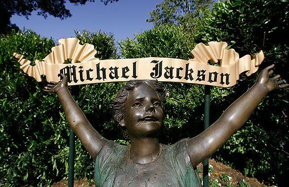 A statue greets visitors at the main entrance to Michael Jackson's Neverland Ranch in Los Olivos. Jackson's family has announced there are no plans for a funeral or burial at the ranch in Central California. But the rural former home of the pop star remains an attraction.