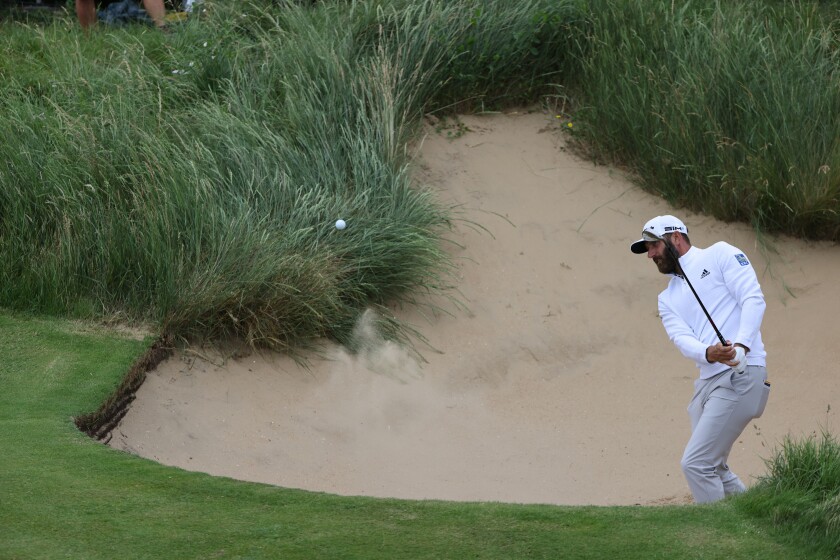 United States' Dustin Johnson hits out of a bunker on the 6th green during a practice round for the British Open Golf Championship at Royal St George's golf course Sandwich, England, Wednesday, July 14, 2021. The Open starts Thursday, July, 15. (AP Photo/Ian Walton)