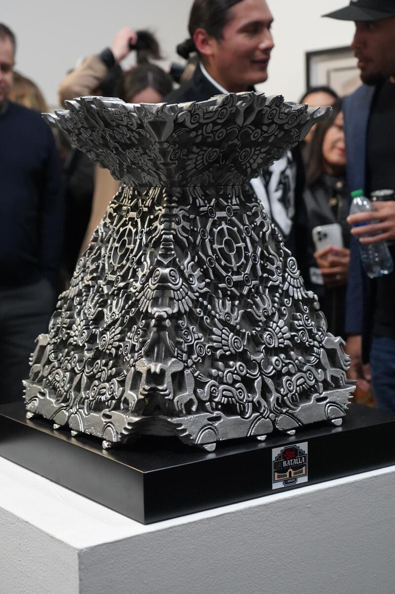 The gleaming, two-foot tall pyramid etched with a collection of Aztec symbols feels more fine art sculpture than trophy.