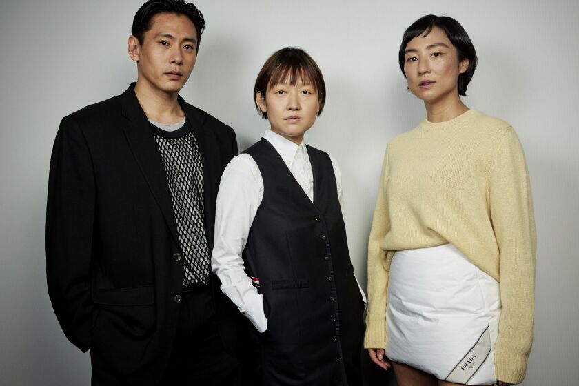Teo Yoo, left, Celine Song and Greta Lee pose for a portrait to promote the film "Past Lives" on Wednesday, May 31, 2023, in New York. (Photo by Matt Licari/Invision/AP)