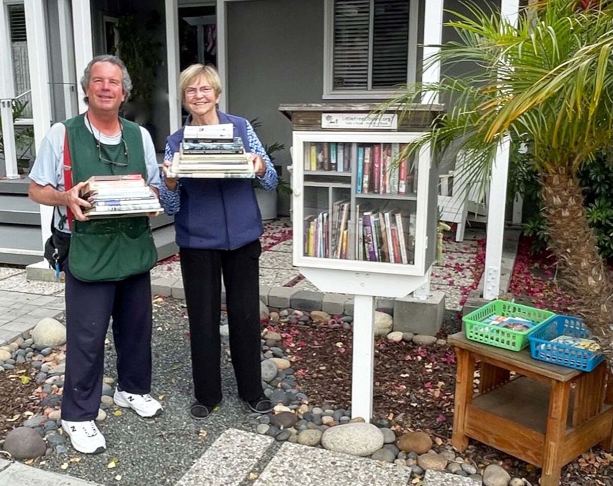 David and Traci Petti with their Little Free Library at 1253 Wilbur Ave.
