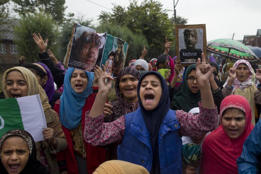 FILE-Kashmiris shout slogans during a protest after Friday prayers against the abrogation of article 370, on the outskirts of Srinagar, Indian controlled Kashmir, Oct. 4, 2019. (AP Photo/ Dar Yasin, File)