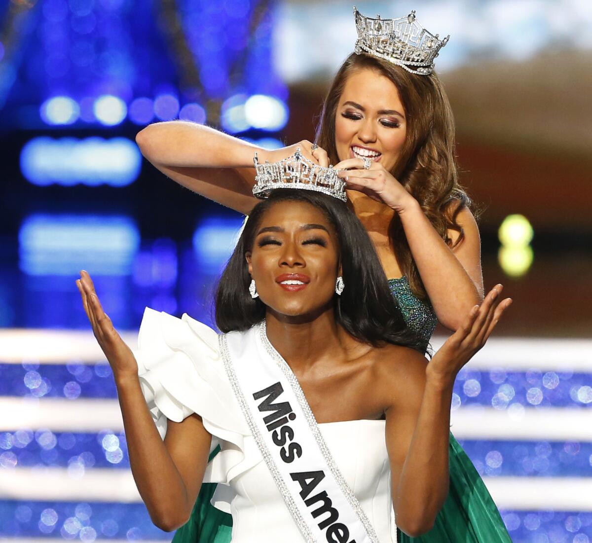 Miss New York Nia Franklin is crowned Miss America 2019 by last year's winner, Cara Mund.