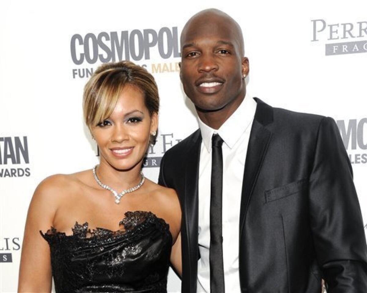 FILE - This March 7, 2011 file photo shows NFL Football player and reality television star Chad Johnson and Evelyn Lozada attending Cosmopolitan Magazine's Fun Fearless Males of 2011 event in New York. Six-time Pro Bowl wide receiver Chad Johnson's divorce is final from reality TV star Evelyn Lozada, a month after his arrest on a domestic battery charge. Johnson's attorney, Adam Swickle, confirmed on Wednesday that the couple who wed on July 4 are now divorced. (AP Photo/Evan Agostini, file)