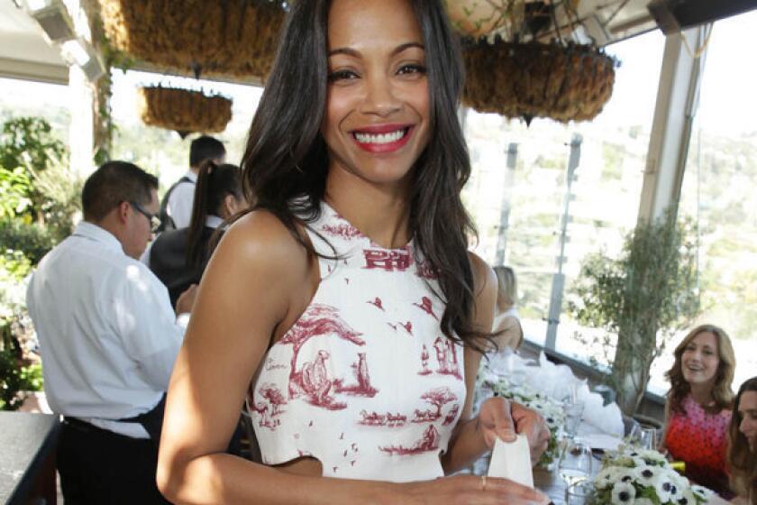 "I tend to recover, you know, healthy and smoothly" from heartbreak, Zoe Saldana tells Latina magazine.