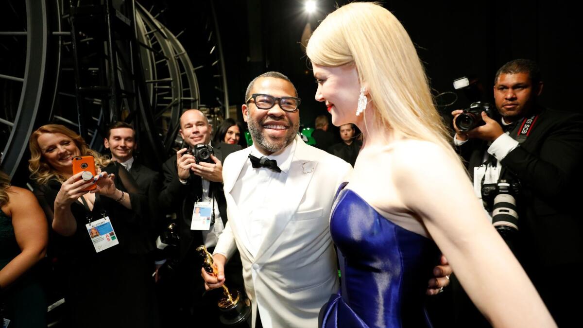 Jordan Peele and Nicole Kidman backstage at the 90th Academy Awards.