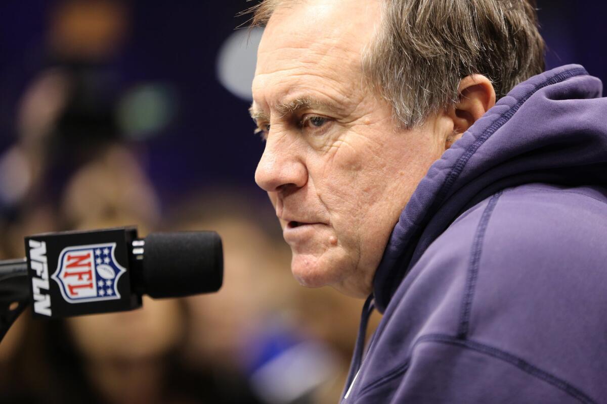 New England Patriots Coach Bill Belichick answers questions during Super Bowl media day on Tuesday in Phoenix.