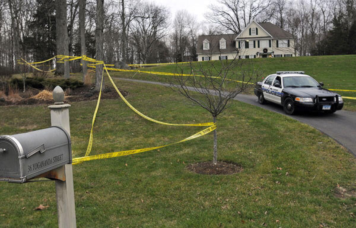 Police tape surrounds the home of Nancy Lanza, who was killed by her son, Adam Lanza. Adam Lanza also killed children and others at Sandy Hook Elementary School in Newtown, Conn.