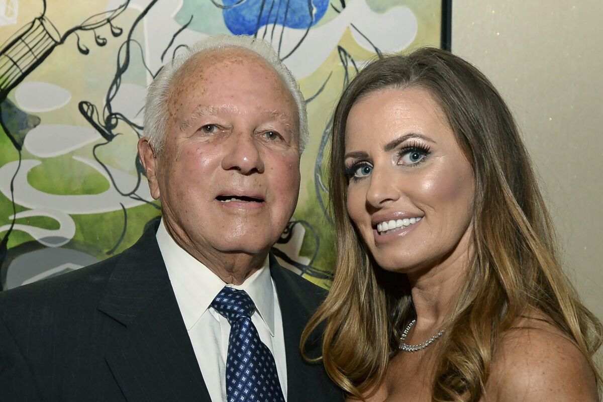 FILE - Former Louisiana Gov. Edwin Edwards, left, celebrates his 90th birthday with his wife, Trina Edwards, at the Renaissance Hotel in Baton Rouge, La., in this Aug. 12, 2017, file photo. Edwin Washington Edwards, the high-living four-term governor whose three-decade dominance of Louisiana politics was all but overshadowed by scandal and an eight-year federal prison stretch, died Monday, July 12, 2021 . He was 93. Edwards died of respiratory problems with family and friends by his bedside, family spokesman Leo Honeycutt said. He had suffered bouts of ill health in recent years and entered hospice care this month at his home in Gonzales, near the Louisiana capital. (Hilary Scheinuk/The Advocate via AP)