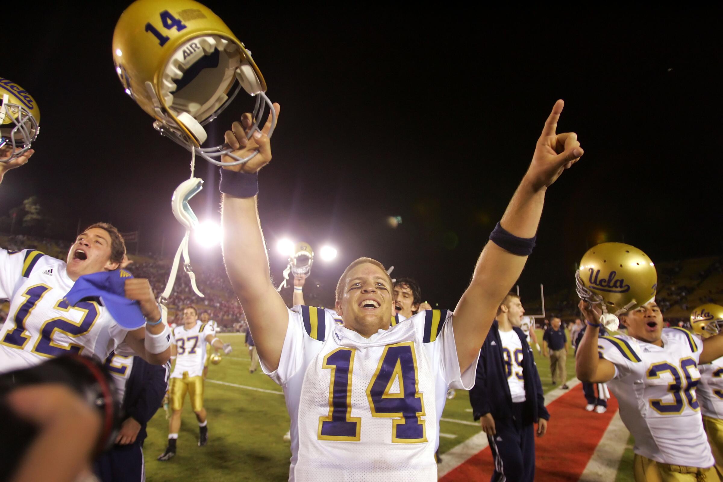 UCLA quarterback Drew Olson celebrates the Bruins' 30-27 overtime win over Stanford on Oct. 29, 2005.