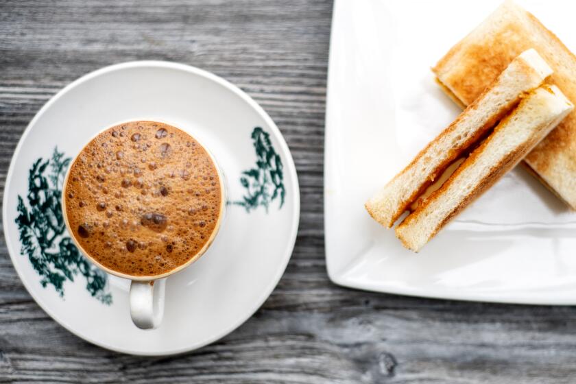 ALHAMBRA, CA - MARCH 31: Kaya & butter toast with a cup of white coffee from Ipoh Kopitiam on Thursday, March 31, 2022 in Alhambra, CA.(Mariah Tauger / Los Angeles Times)