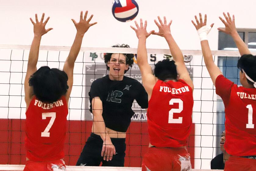 Sage Hill's Jackson Cryst (12) spikes the ball past Fullerton's Jorge Vasquez (7) Nathan Medina (2) and Hyunmin Kim (11) during Sage Hill High School boys' volleyball team against Fullerton High School boys' volleyball team in the CIF Southern Section Division 5 boys' volleyball playoffs at Fullerton High School in Fullerton on Thursday, April 25, 2024. (Photo by James Carbone)