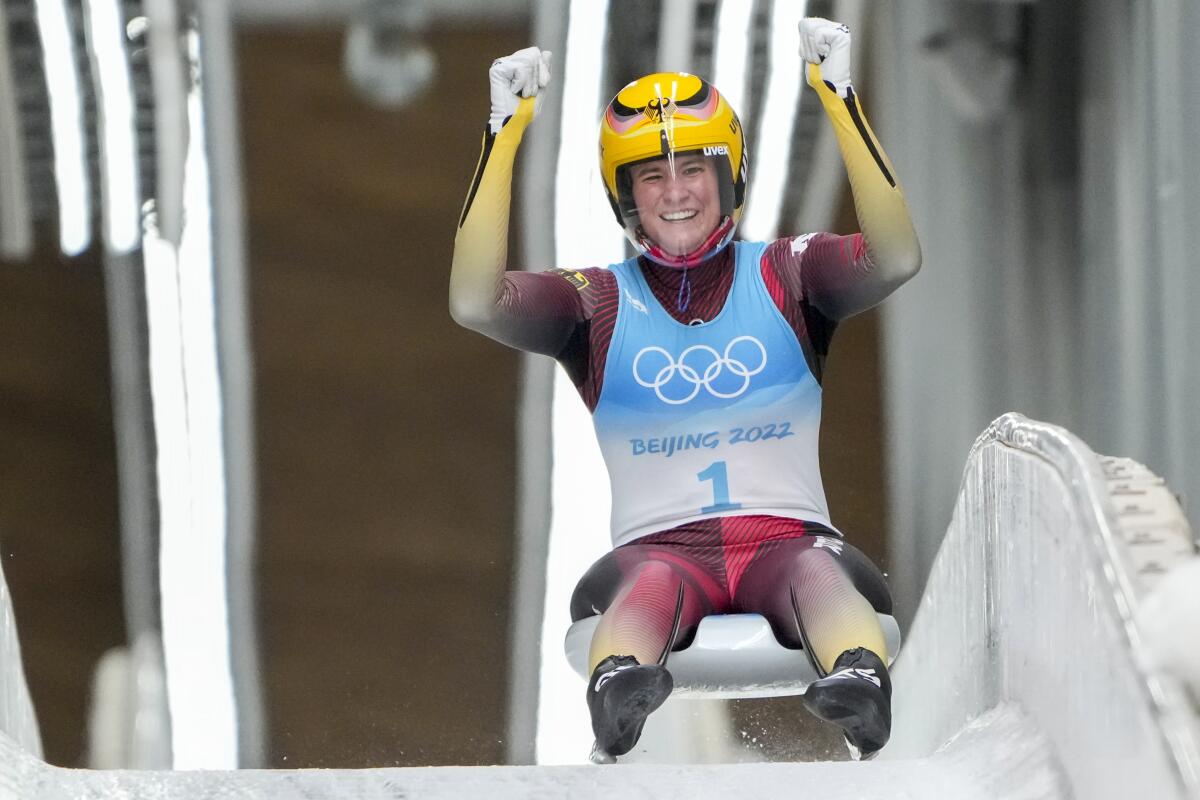 Natalie Geisenberger of Germany celebrates after competing in women's luge Tuesday at the 2022 Winter Olympics.