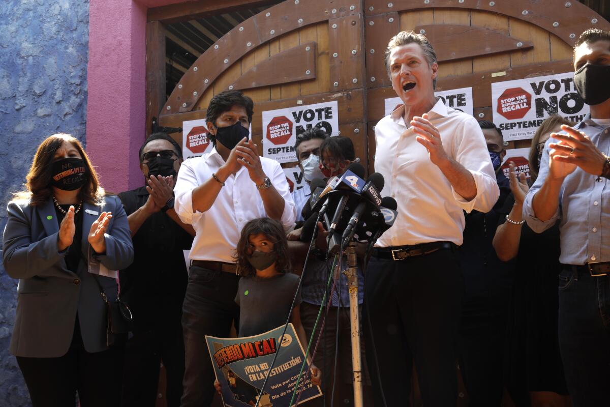 Gov. Gavin Newsom speaks outside a restaurant in East Los Angeles during a meetings with Latino leaders. 
