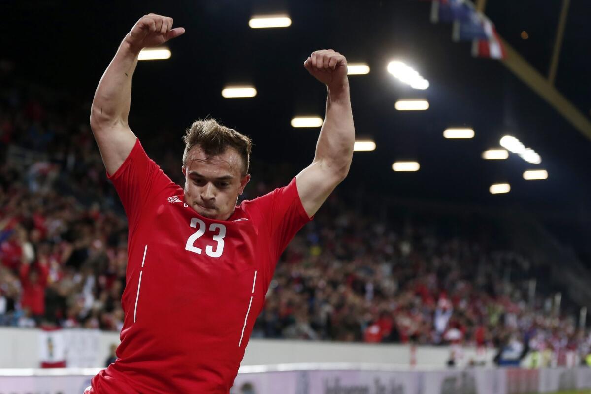 Switzerland's Xherdan Shaqiri celebrates after scoring a goal during an international friendly soccer match against Peru.