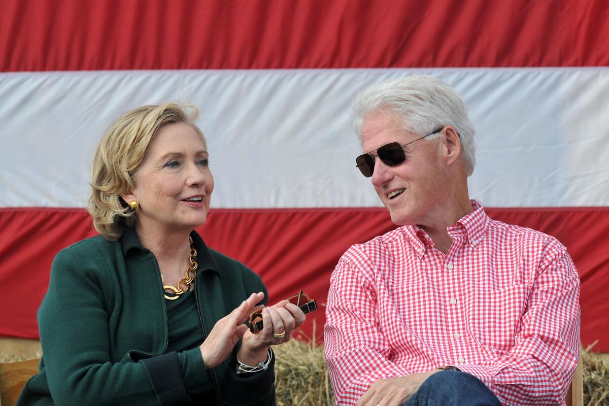 Hillary and Bill Clinton attend Sen. Tom Harkin's steak fry in Indianola, Iowa, on Sunday.