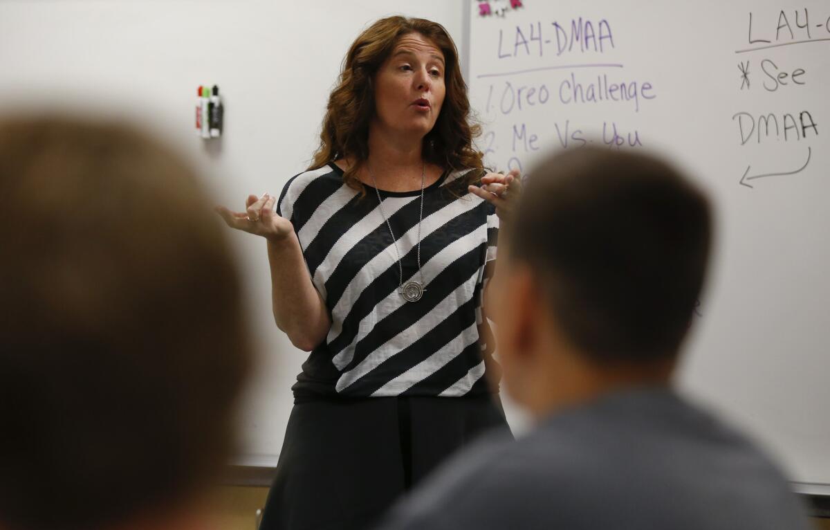 Teacher Kathleen Switzer welcomes her students to a new school year at El Dorado High School in Placentia. Among her first-day-back activities: “get-to-know-you bingo.”