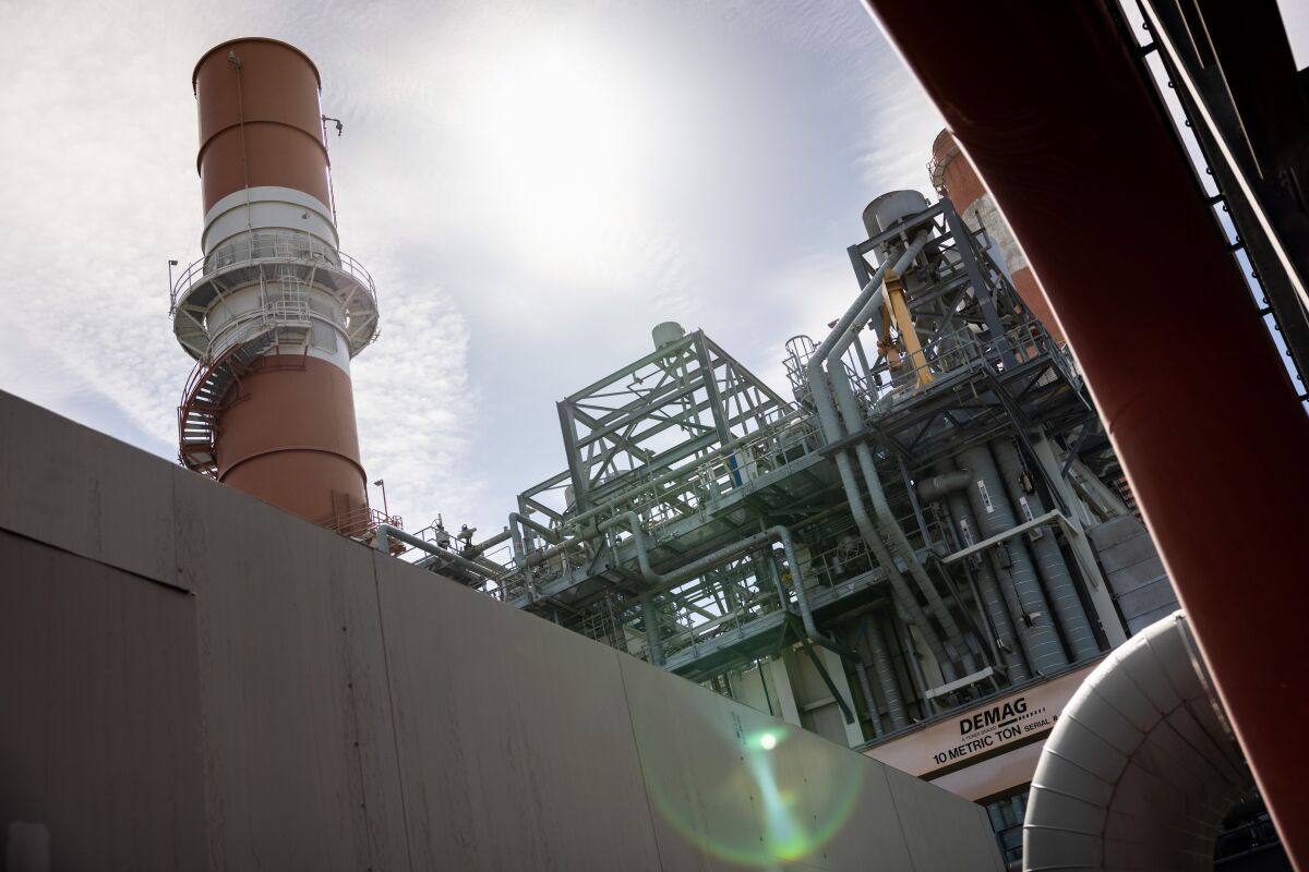 Closeup view, toward the sky, of a smokestack.
