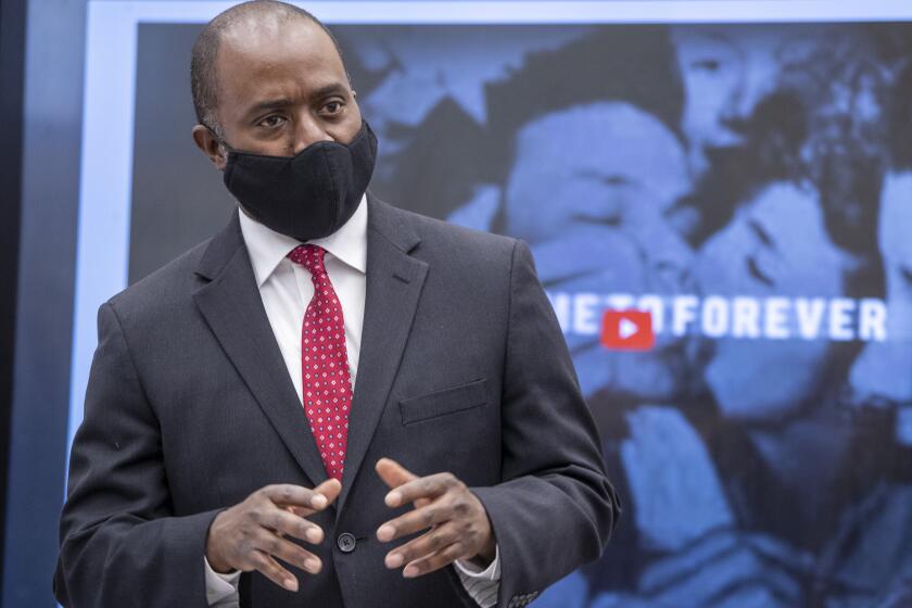 VAN NUYS, CA - APRIL 28: State Superintendent of Public Instruction Tony Thurmond talks with students during a tour of Van Nuys High School classrooms on Wednesday, April 28, 2021 in Van Nuys, CA. (Brian van der Brug / Los Angeles Times)