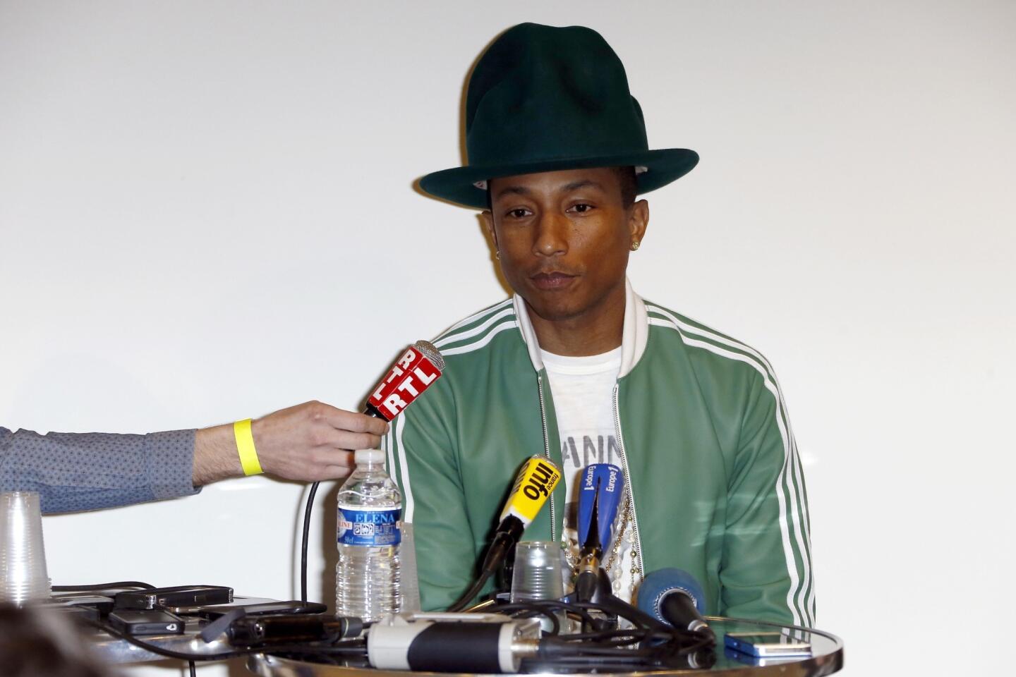 Pharrell Williams' quest for total domination of pop, and our hearts, continues with the singer-producer's announcement that he'll release his first album in nearly eight years, "G I R L," on March 3. If the album sounds anything like his gleeful clap-along "Happy" -- which might score him an Oscar -- or his slinky Grammy-winning work with Daft Punk (the robotic French duo also appear on the record), the soundtrack of this summer has just arrived.