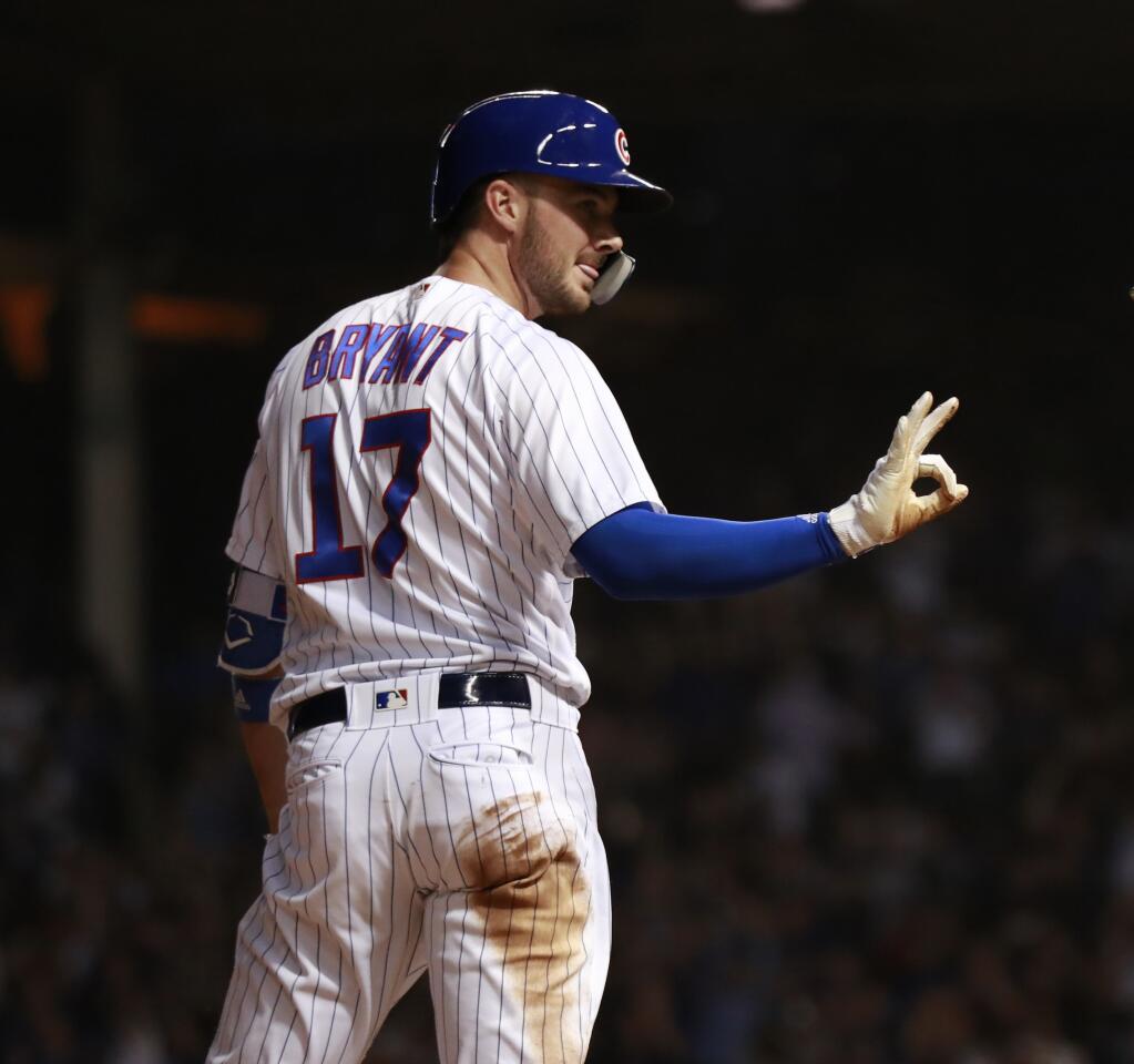 Kris Bryant after his triple against the Colorado Rockies during the sixth inning of their game at Wrigley Field in Chicago on Monday, April 30, 2018.