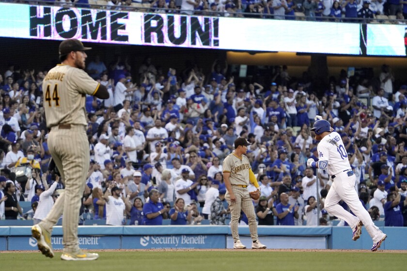 The Dodgers' Justin Turner rounds third base after hitting a solo home run off Padres pitcher Joe Musgrove 