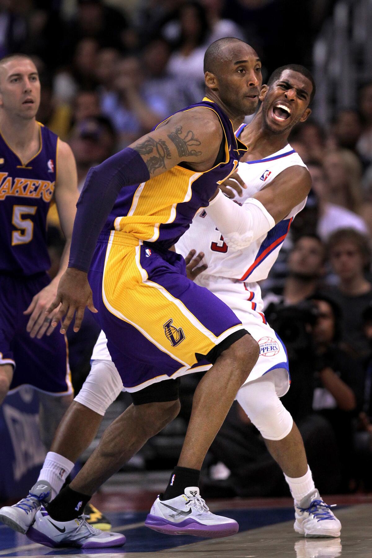 Clippers point guard Chris Paul reacts after getting fouled by Lakers guard Kobe Bryant in the fourth quarter Sunday afternoon.
