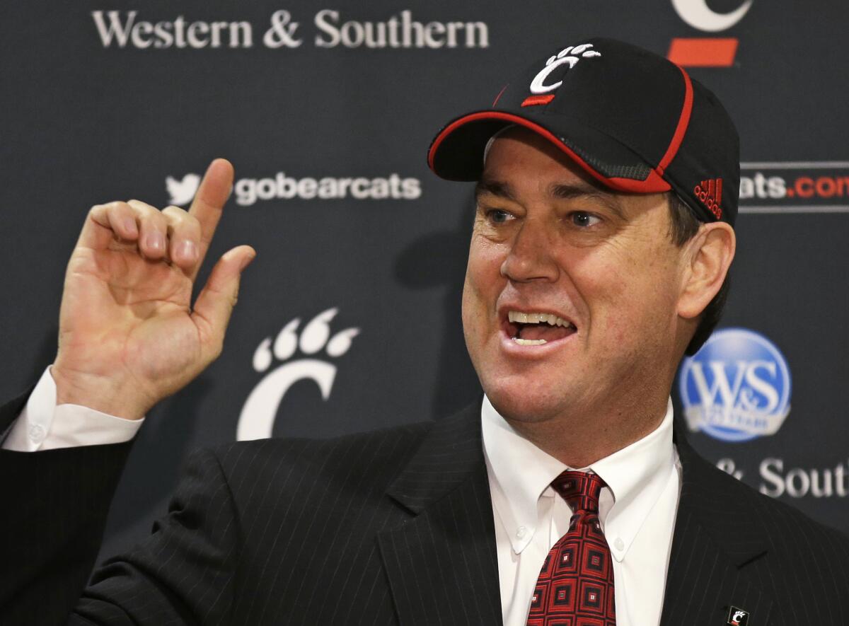 Mike Bohn speaks at a news conference after being introduced as Cincinnati's athletic director in February 2014.
