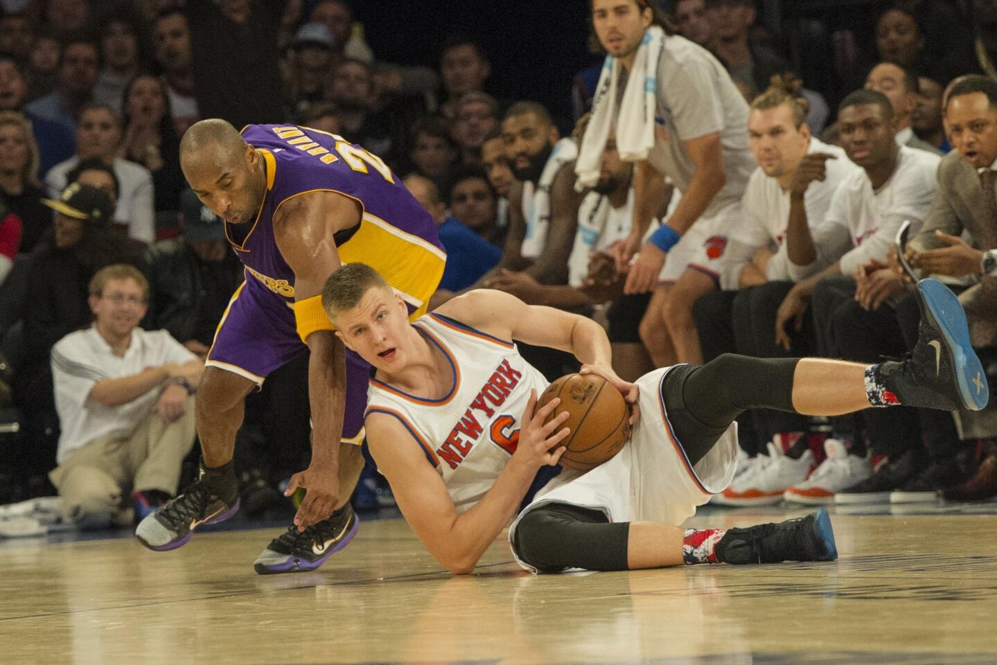 Nov 8, 2015; New York, NY, USA; New York Knicks power forward Kristaps Porzingis (6) grabs the loose ball with Los Angeles Lakers small forward Kobe Bryant (24) during the 4th qtr at Madison Square Garden. Mandatory Credit: The Knicks won 99-95. Gregory J. Fisher-USA TODAY Sports ** Usable by SD ONLY **
