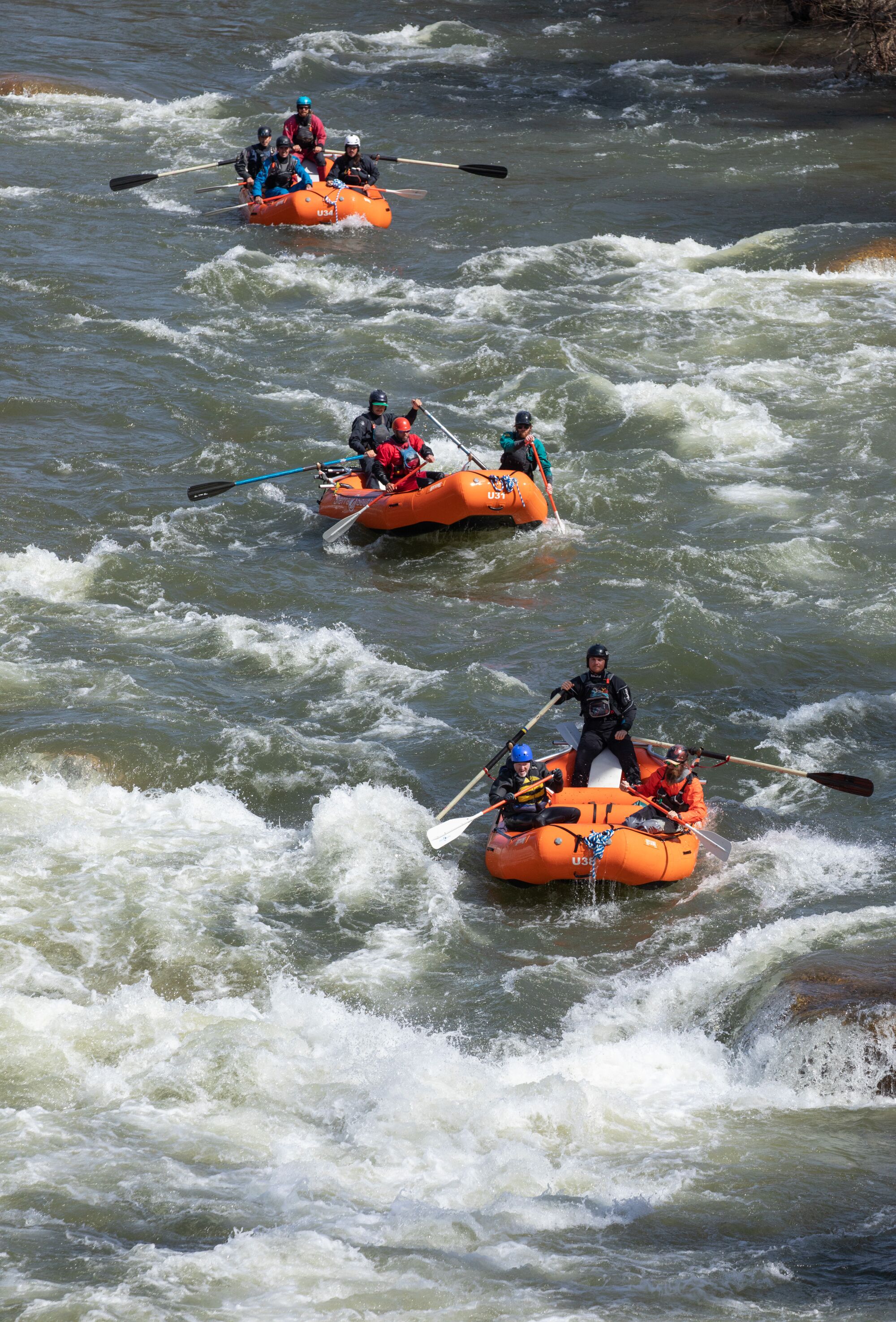 Los Angeles Times reporter Jack Dolan helps guide his raft through the turbulent waters of the Upper Kern River.