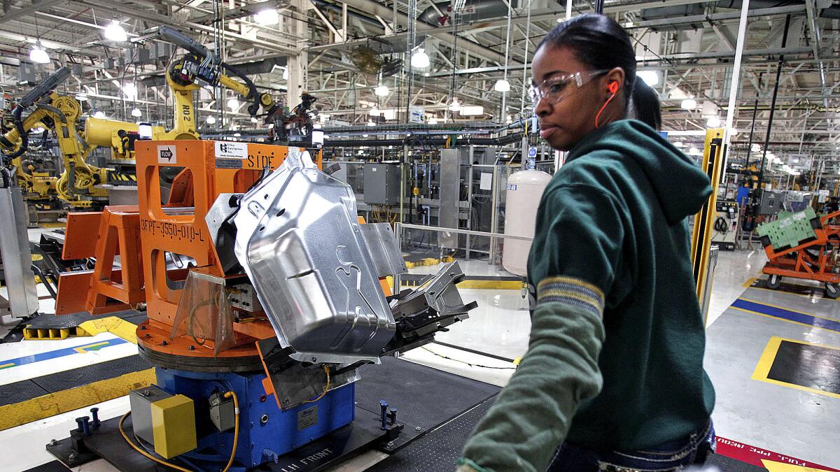 Imani Long works at a Fiat Chrysler Automobiles plant in Warren, Mich., in 2016.