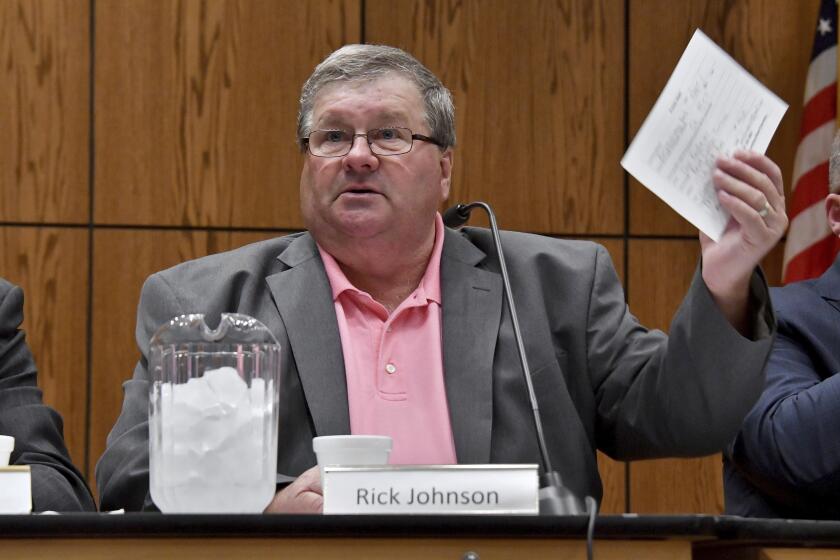 FILE - Rick Johnson chairs the committee as it meets before a capacity crowd in Lansing, Mich., June 26, 2017, at the first open meeting of the Michigan Medical Marijuana Board. (Dale G Young/Detroit News via AP, File)
