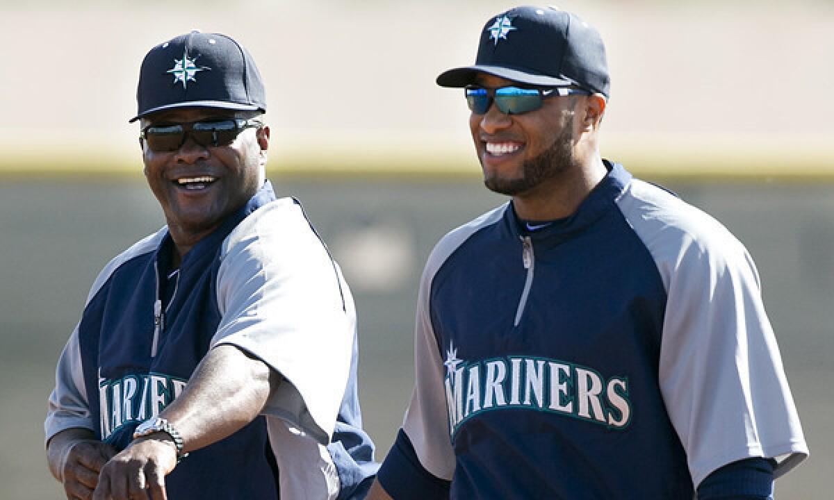 Seattle Mariners Manager Lloyd McClendon, left, and second baseman Robinson Cano talk during a spring-training practice session on Feb. 18. McClendon believes the AL West will be a very competitive division in 2014.