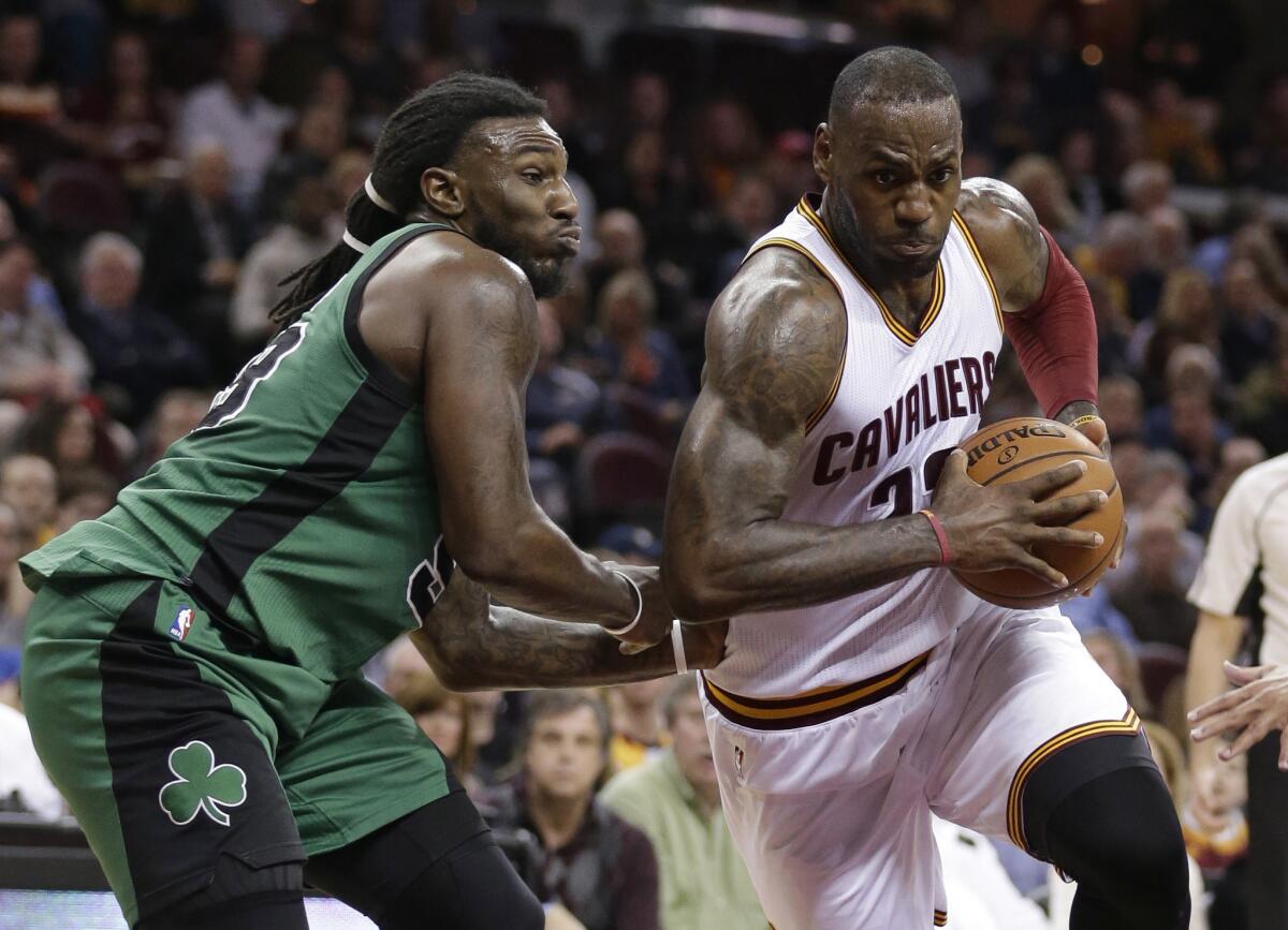 Cleveland Cavaliers forward LeBron James drives past Boston Celtics forward Jae Crowder during the second half of a game on March 5.